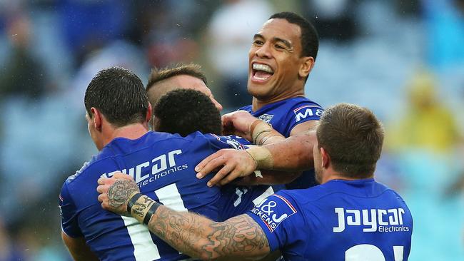 Will Hopoate celebrates with teammates.