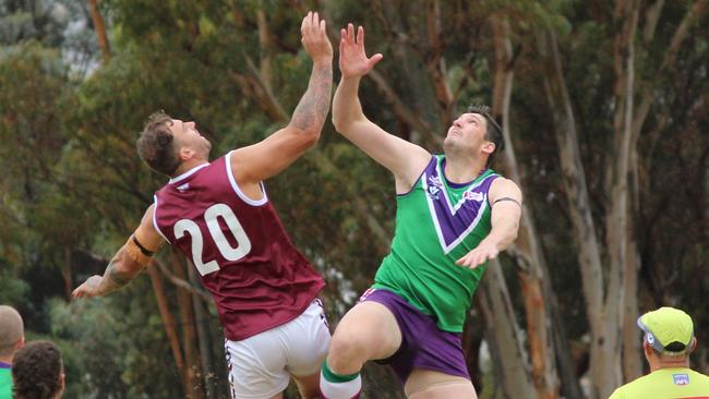 Nullawil's Dean Putt and Birchip-Watchem’s Lochlan Sirett leap to tap out the ball during the contest. Picture: Wendy Watts.