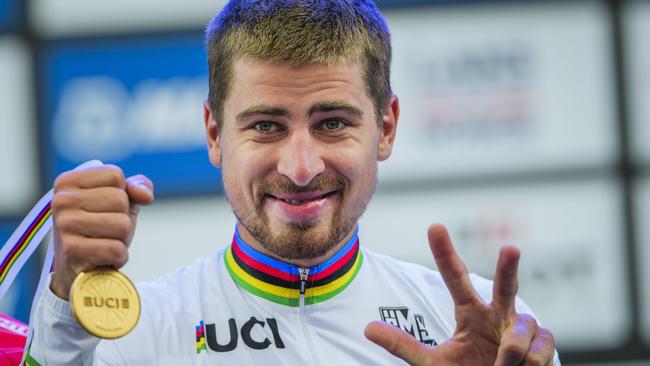 Peter Sagan celebrates his third straight UCI road world championship. He is returning to Adelaide for next year’s Santos Tour Down Under. Picture: Jonathan Nackstrand (AFP).