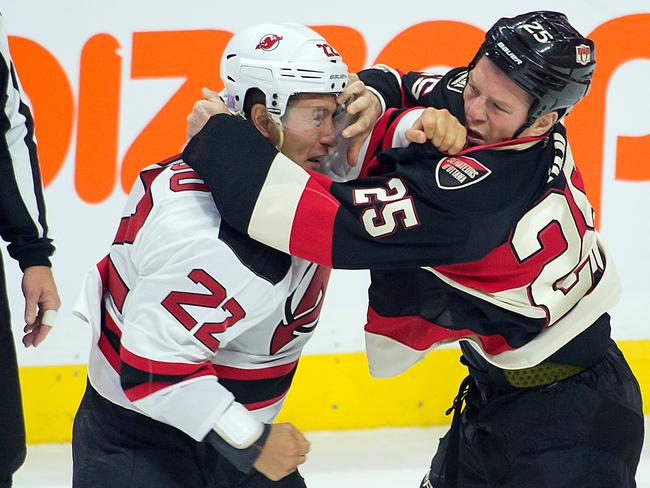 Former Ottawa Senators player Chris Neil and his family watch as a