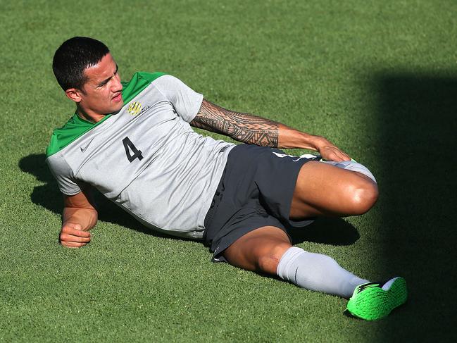 NEWCASTLE, AUSTRALIA - JANUARY 25: Tim Cahill stretches during an Australian Socceroos Asian Cup training session at Cooks Hill No.2 Sports Ground on January 25, 2015 in Newcastle, Australia. (Photo by Tony Feder/Getty Images)