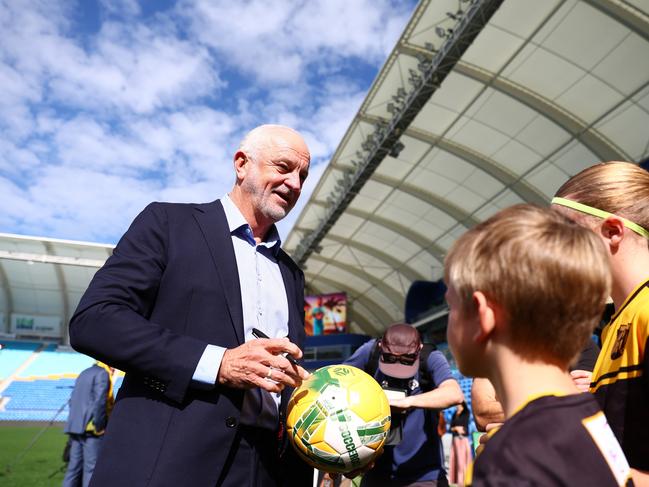 Graham Arnold, Socceroos head coach with players from Mudgeeraba Soccer Club. Picture: Chris Hyde/Getty Images.