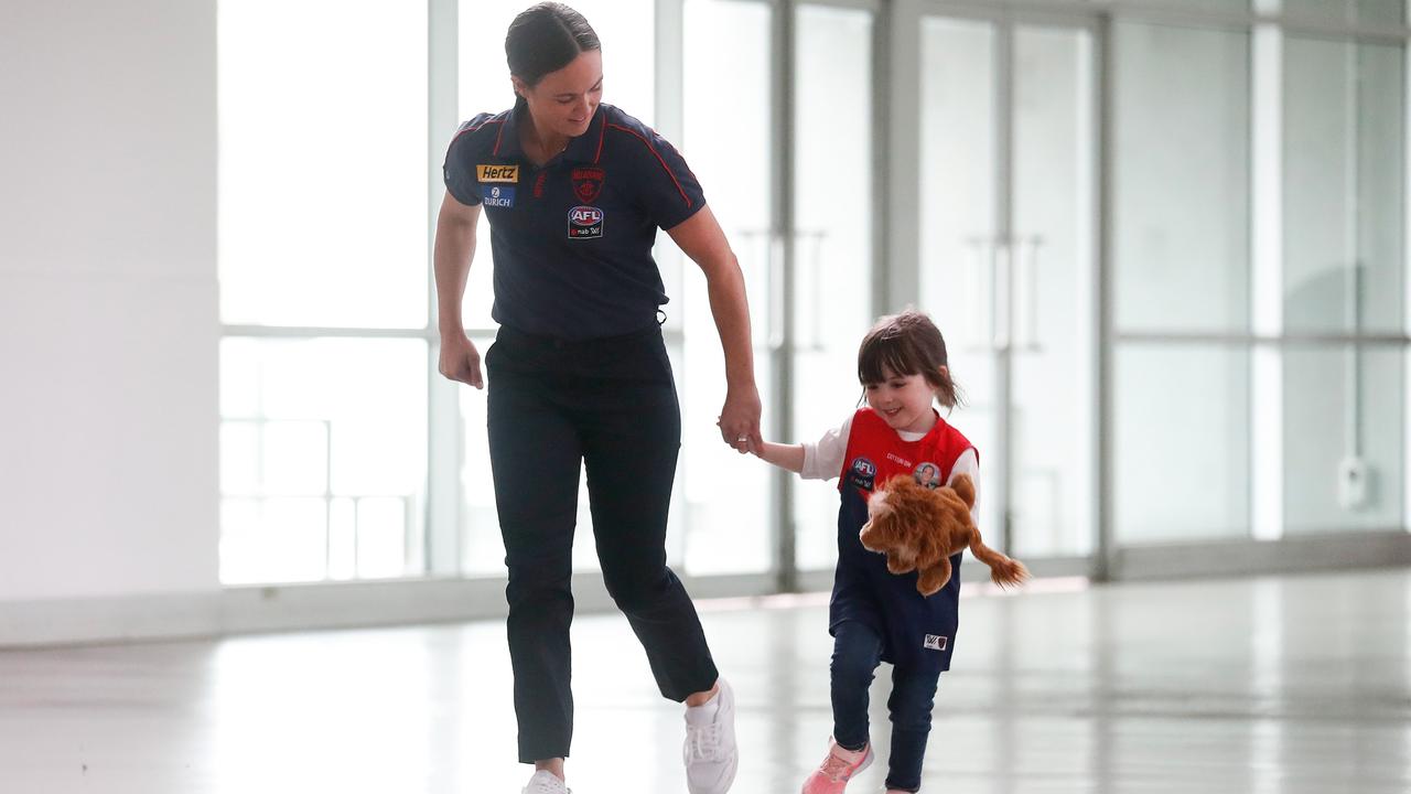 Daisy Pearce and daughter Sylvie at the Press Conference announcing the retirement of Pearce at the MCG. Picture: Getty Images