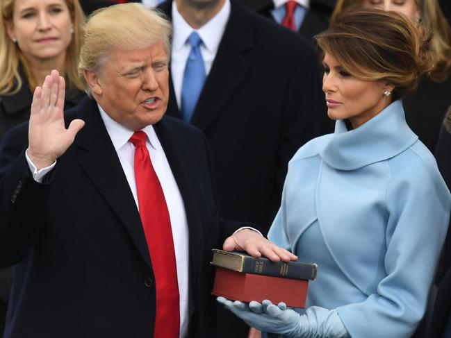 Donald Trump, with his wife Melania, being sworn in as President at the US Capitol in Washington, DC. Picture: AFP