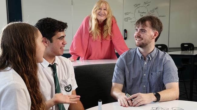 Students Chelsea Carman, 15, and Lincoln Harrison, 15, with principal Sharon Amos and teacher Nick Houseman at Park Ridge State High School. Picture: Liam Kidston