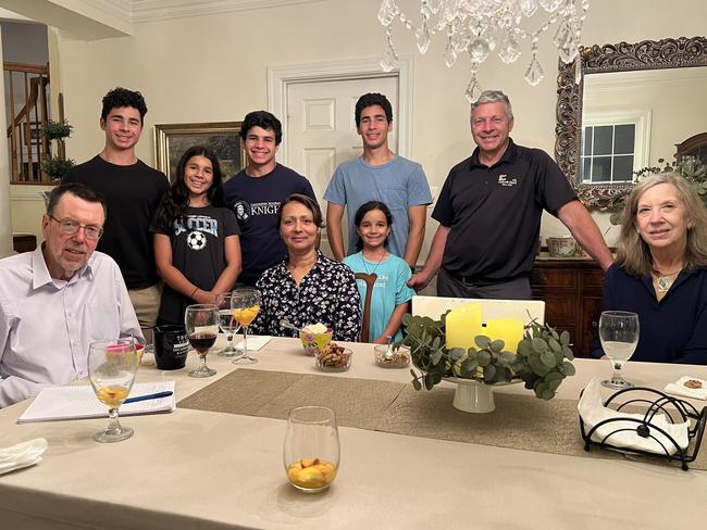 Greg Sheridan, left, with the Cleary family at their home.