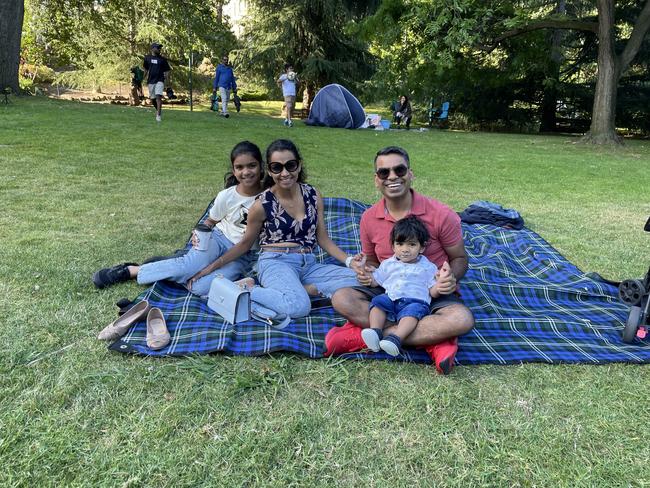 Ajay and Sadhana Prajapati &amp; kids at Treasury Gardens in the Melbourne CBD for the 2024 New Year's Eve fireworks. Picture: Gemma Scerri