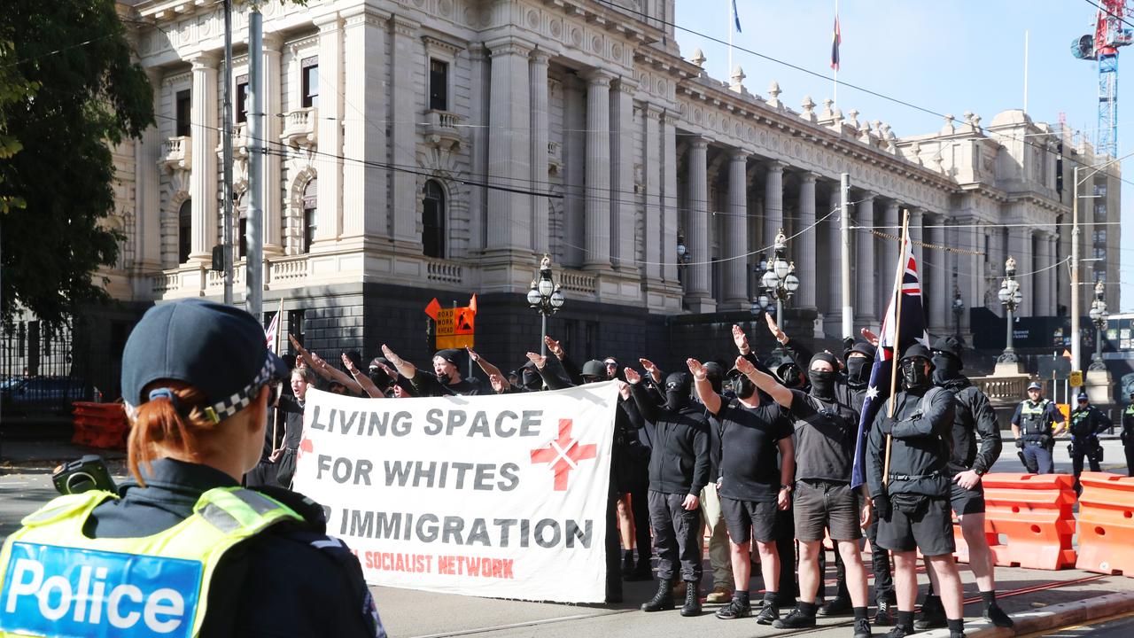 Many of the National Socialist Network protesters chose to cover their faces and wear all-black attire. Picture: NCA NewsWire / David Crosling