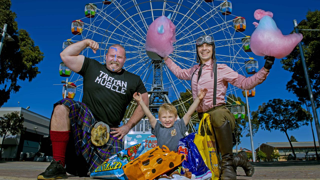 Strong Man Jordan Biggie Steffans ,Sonny Roux, 4, with show bags and the amazing Captain Sky Doodles and his fairy floss creations all ready for the Adelaide Royal Show. Picture Mark Brake