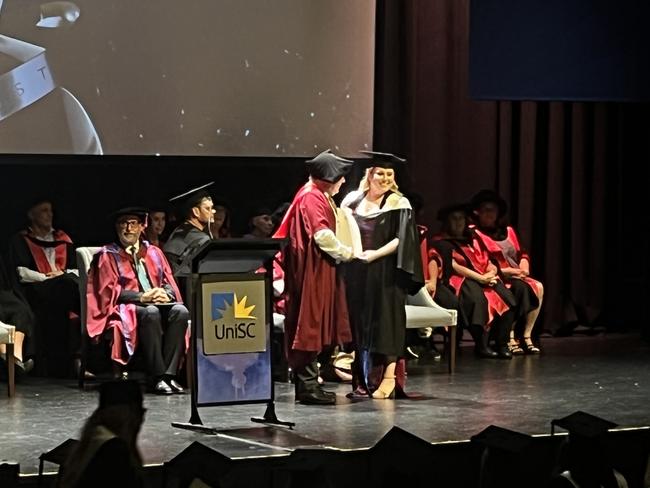 Graduates from the University of the Sunshine Coast's Fraser Coast campus celebrating at the Brolga Theatre.