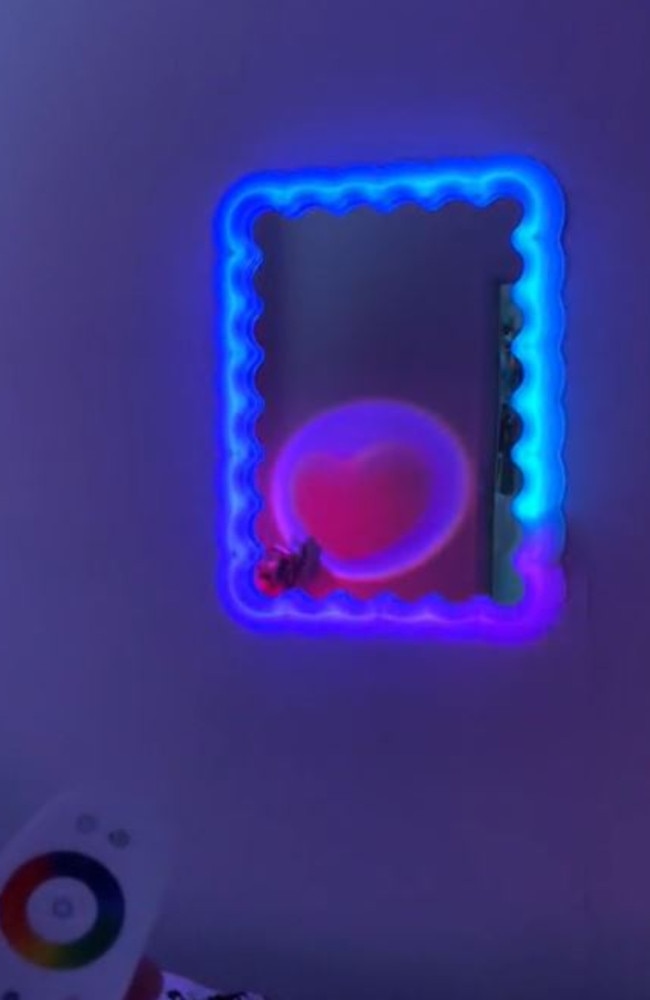 The mirror has a remote control and switches between a variety of colours. Picture: TikTok