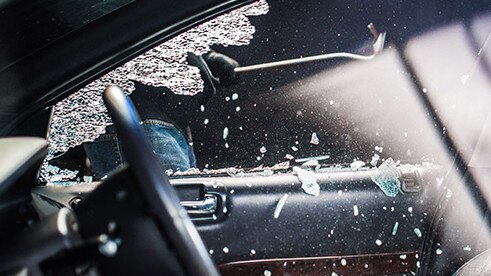 The man’s had his car window’s smashed in. (Stock image.)