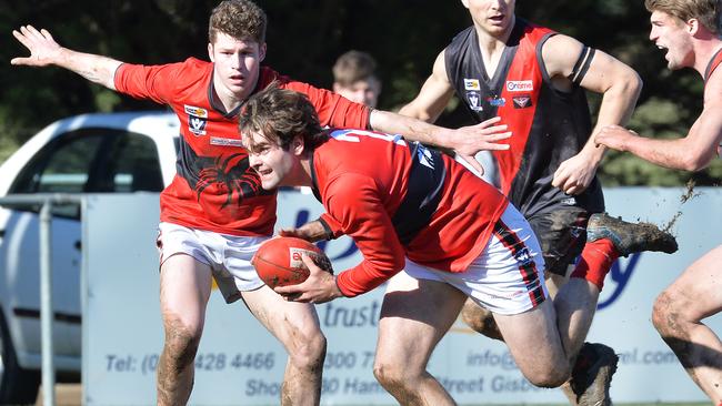 Rowan Stott extracts the footy for Romsey. Picture: Rob Leeson