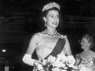 1954 Royal Tour. Queen Elizabeth at the State Ballroom in Hobart for a civic reception. Her gown is of the palest lithe pink swiss embroided organdie. Tasmania.