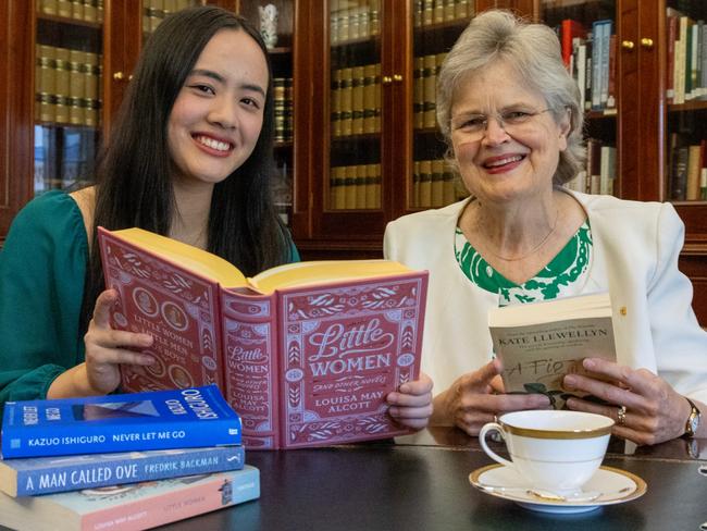 February 6, 2025:  18-year-old student Mia Ohara Ngo, the 2025 Tennyson Medal recipient, with a selection of fav books, with Her Excellency the Honourable Frances Adamson AC, Governor of South Australia, in the Government House library. Picture: Kelly Barnes