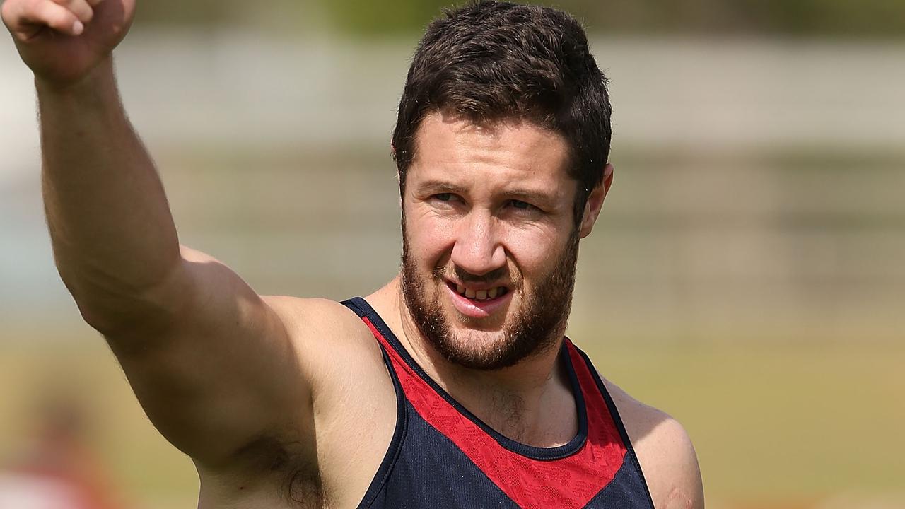 ALICE SPRINGS, AUSTRALIA - MAY 30: James Frawley gestures to fans during a Melbourne Demons AFL training session on May 30, 2014 in Alice Springs, Australia. (Photo by Michael Dodge/Getty Images)