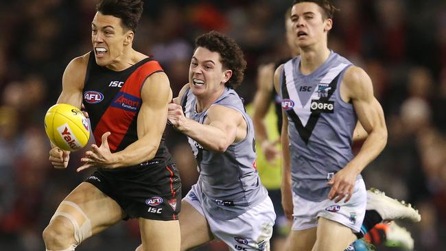 Darcy Byrne-Jones chases Essendon's Dylan Shiel in the Power’s win over the Bombers. Picture: Michael Klein.