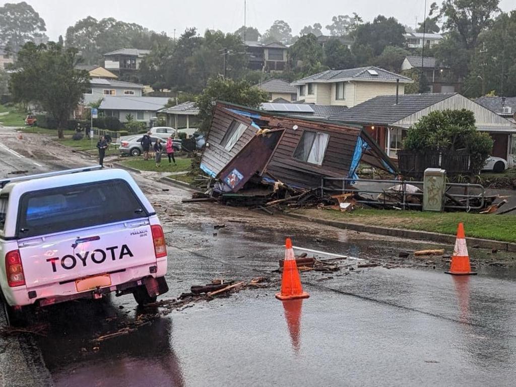 A small cabin is washed away by floodwaters after a night of heavy rain in Mt Kiera.