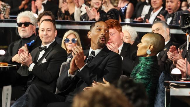 Will and Jada, with the seat filler visible between them. Picture: Getty