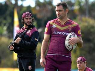 INJURED STAR: Johnathan Thurston (left) looks on during the Queensland State of Origin team training session at Sanctuary Cove on the Gold Coast. Picture: DAVE HUNT