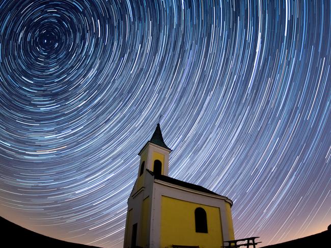 NIEDERHOLLABRUNN, AUSTRIA - APRIL 21: (EDITORS NOTE: Multiple exposures were combined to produce this image.) Startrails are seen during the Lyrids meteor shower over Michaelskapelle on April 21, 2020 in Niederhollabrunn, Austria. The clear skies created by the New Moon coincide with the Lyrid meteor shower, an annual display caused by the Earth passing through a cloud of debris from a comet called C/186 Thatcher. (Photo by Thomas Kronsteiner/Getty Images)