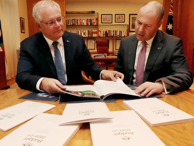 Prime Minister Scott Morrison with Treasurer Josh Frydenberg look over the budget papers ahead of tonight's budget announcement at Parliament House on Tuesday, October 6, 2020.  Picture: Adam Taylor for PMO via NCA NewsWire