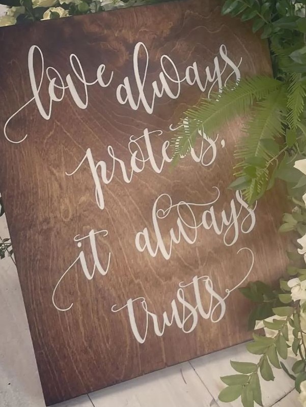 ‘Love always protects, it always trusts,’ another sign read.