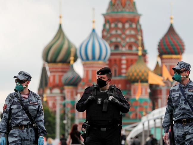 Russian law enforcement officers wearing protective face masks in Moscow. Picture: Reuters