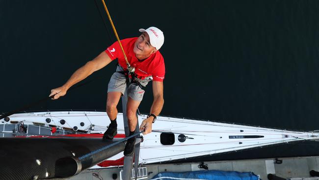 WARNING DO NOT USE WITHOUT PERMISSION FROM JAMES SILVER DAILY TELEGRAPH SPORT OR PICTURE DESK HOLD FOR Boxing Day - Wild Oats XI bowman Tim Wiseman climbs the mast to check the rigging ahead of the 2019 Sydney Hobart Yacht Race, at Woolwich Dock Sydney. Picture: Brett Costello