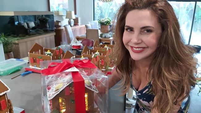 Stonnington mayor Melina Sehr with a gingerbread house made by her business Wonder Ever After. Picture: Facebook