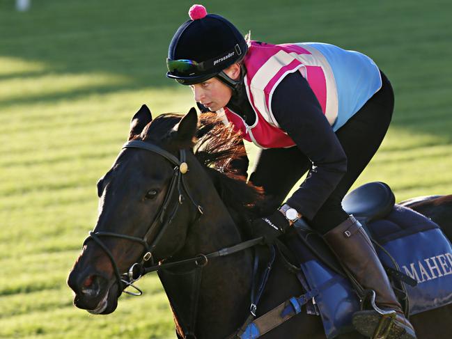 Lucy Yeomans on Azkadellia with trainer Ciaron Maher. EARLY MORNING HORSE TRACKWORK at EAGLE FARM. Pic Annette Dew