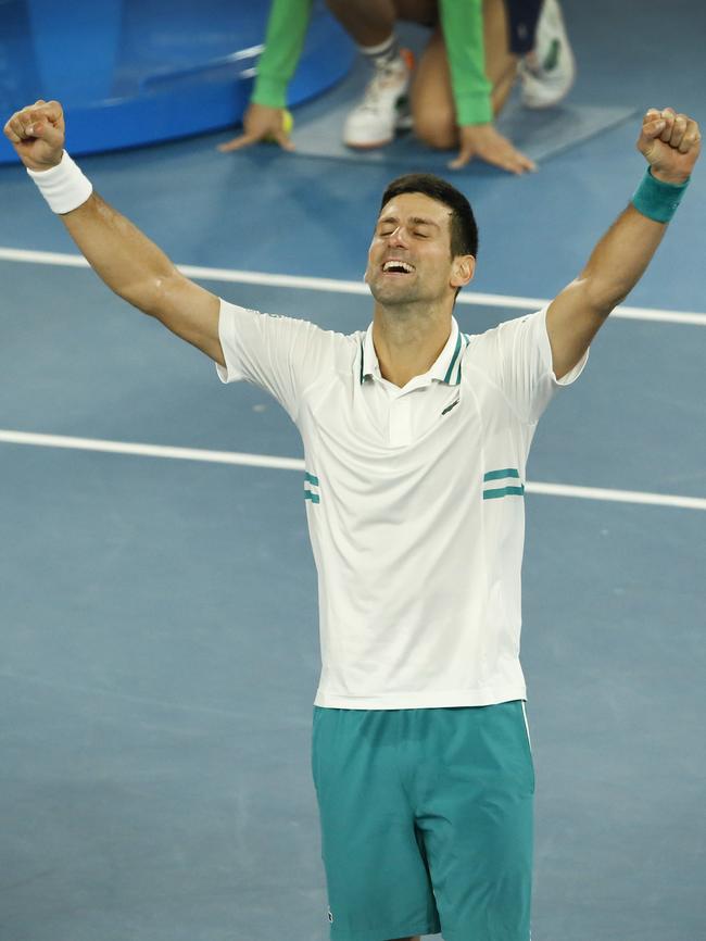 Novak Djokovic raises his arms in victory. Picture: David Caird