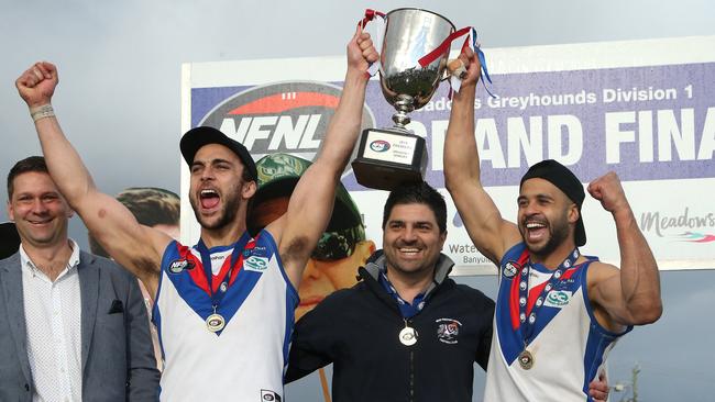 West Preston-Lakeside co-captains Nathan Valladares and Ahmed Saad lift the premiership cup with coach Rob Maiorana. Picture: Hamish Blair