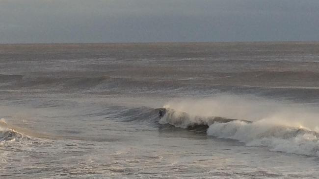 Boardriders brave the surf at Burleigh Heads this morning. Picture: Nic McElroy