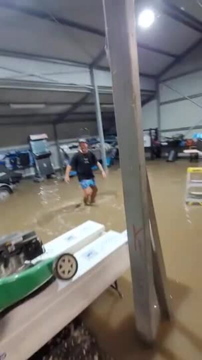 Lockyer Valley residents dance in flooded shed