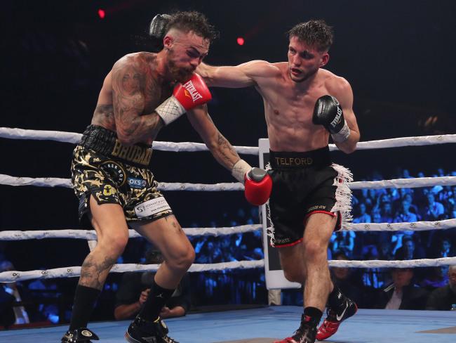 Jack Brubaker (L) and Ty Telford went to war in a brutal undercard fight. Picture: Brett Costello