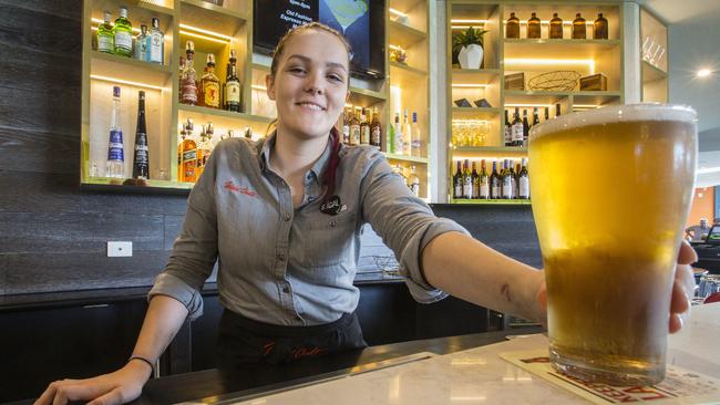 Sammy Whitelaw serving a beer at the bar. Picture: Valeriu Campan