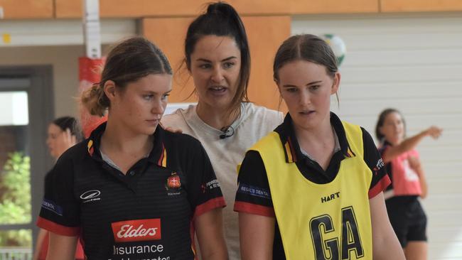 Former Australian Diamonds player Sharni Norder with Rockhampton Grammar players Mia Victorsen (left) and Gayle Parker.