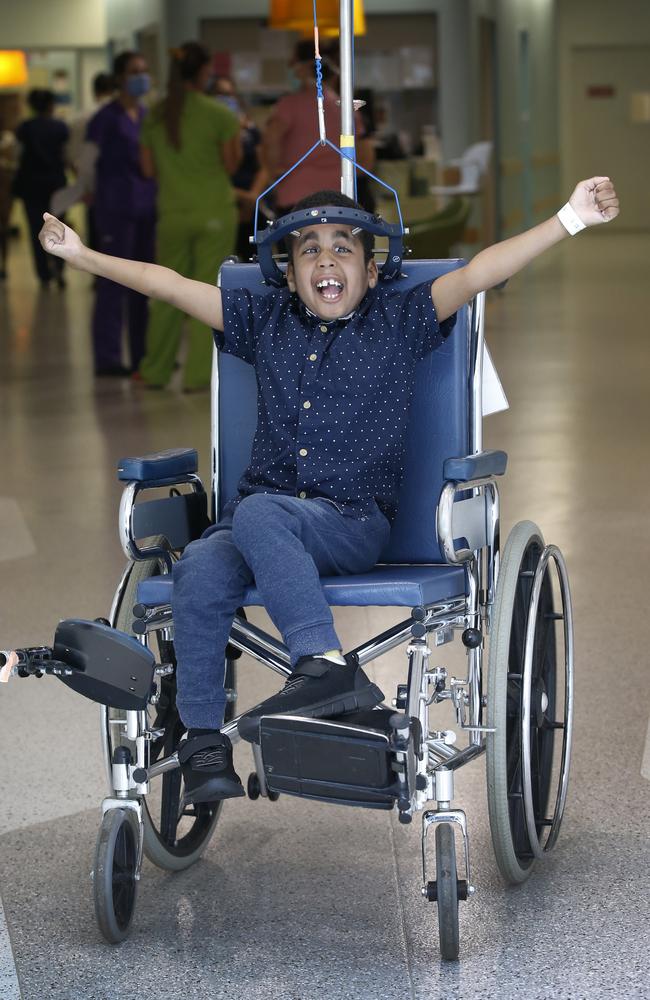 Abubakar wears a halo waiting for spinal surgery. Picture: David Caird