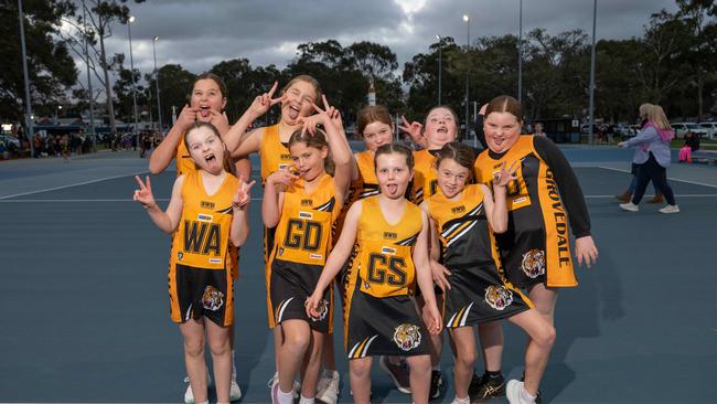 Grovedale Black under-11 netball team pull their funniest faces.