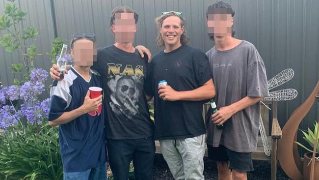 Quinn McPherson, second from right, has been charged over the death of another Adelaide man in Melbourne.