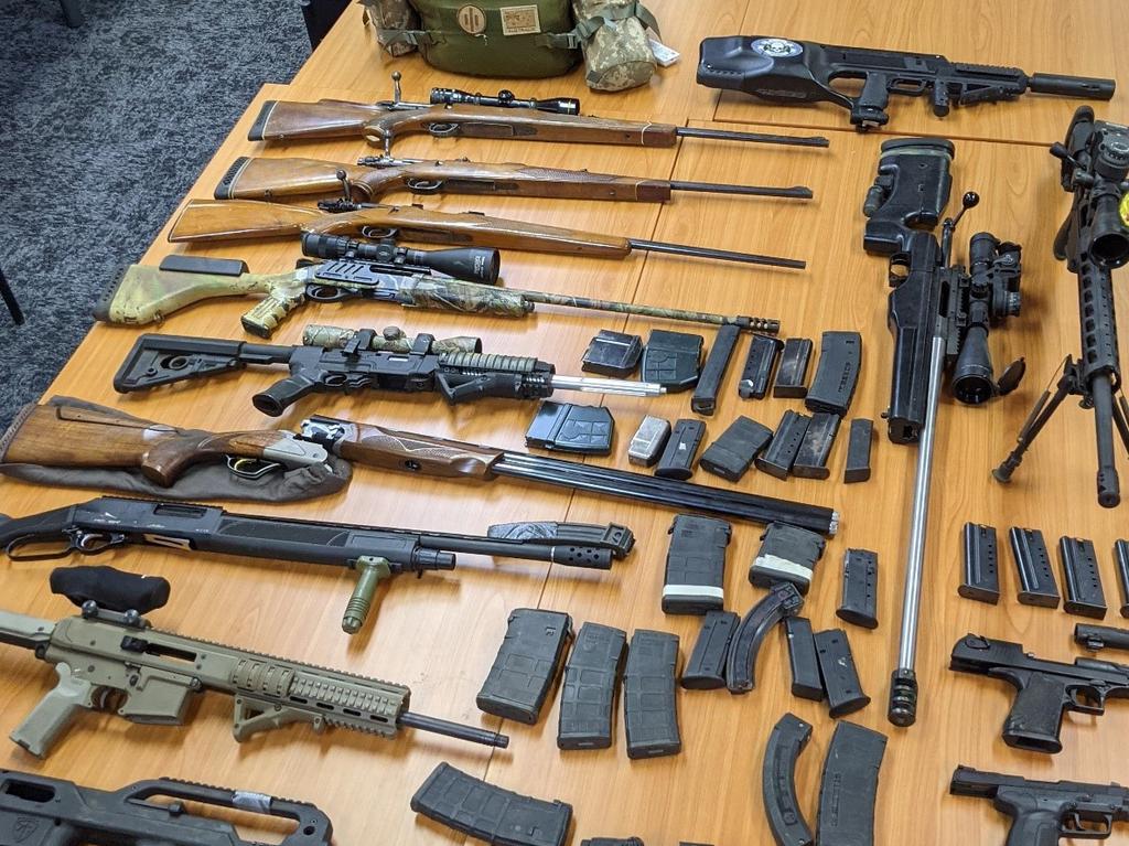 Police allegedly seized automatic guns, rifles and handguns during raids on properties across north Brisbane. Picture: Queensland Police