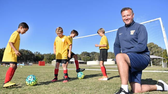 Sunshine Coast Fire players Jett Ford, Cooper Renzulli, Daniel Dawes and Bodi Ahfock with Melvyn Wilkes. Photo Patrick Woods / Sunshine Coast Daily.