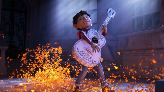 This image released by Disney-Pixar shows characters Miguel, voiced by Anthony Gonzalez in a scene from the animated film, "Coco." (Disney-Pixar via AP)