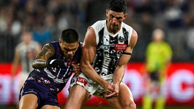 PERTH, AUSTRALIA - MAY 24: Scott Pendlebury of the Magpies competes for the ball with Michael Walters of the Dockers during the 2024 AFL Round 11 match between Walyalup (Fremantle) and the Collingwood Magpies at Optus Stadium on May 24, 2024 in Perth, Australia. (Photo by Daniel Carson/AFL Photos via Getty Images)