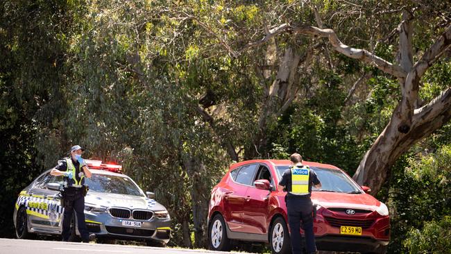 Police patrolling the NSW-Victoria border near Wodonga checking for border passes. Picture: Simon Dallinger.