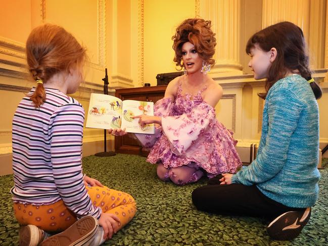 Drag Queens story time reading at Parliament House for IDAHOBIT Day.  Drag Queen Sam T reads a story book called my Shadow is Pink to children Harriet 8 and Lilly 9.                    Picture: David Caird