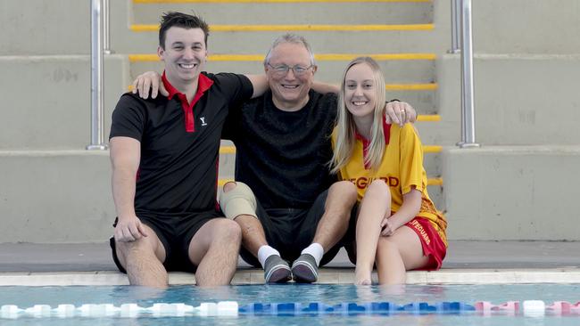 Les Maslin, centre, with lifeguards Lochlan Norton and Danielle Begg, who saved his life after a sudden cardiac arrest while swimming at Noble Park Aquatic Centre. Picture: Andy Brownbill