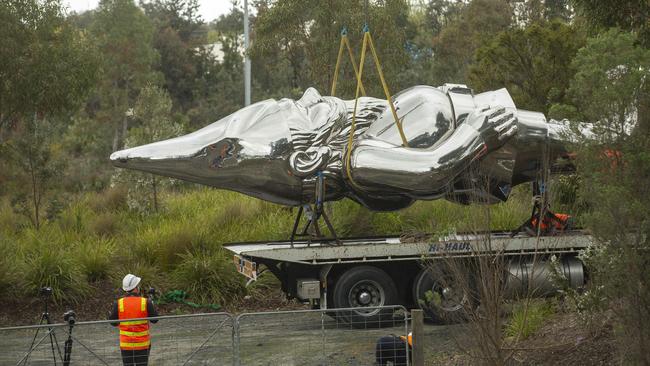 “Frankie” is lowered on to the back of a truck. Picture: Valeriu Campan