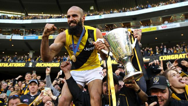 MELBOURNE, AUSTRALIA - SEPTEMBER 30:  Bachar Houli of the Tigers celebrates with fans after winning the 2017 AFL Grand Final match between the Adelaide Crows and the Richmond Tigers at Melbourne Cricket Ground on September 30, 2017 in Melbourne, Australia.  (Photo by Cameron Spencer/AFL Media/Getty Images)